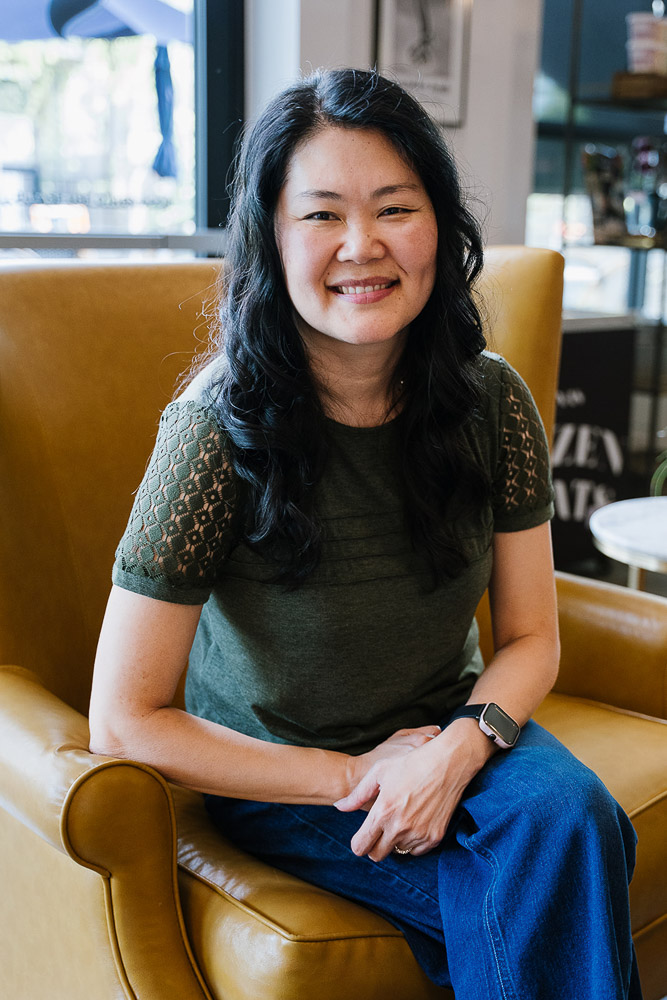 lifestyle family photographer sitting and smiling in Austin