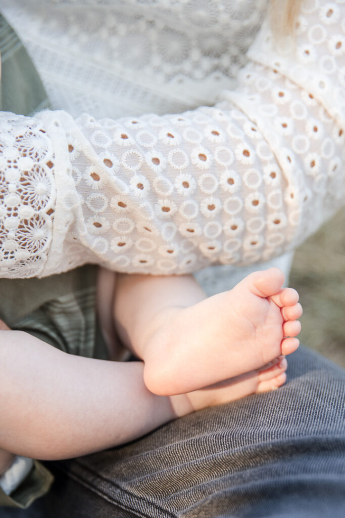 Close up of newborn feet during natural out-door newborn photography in Austin