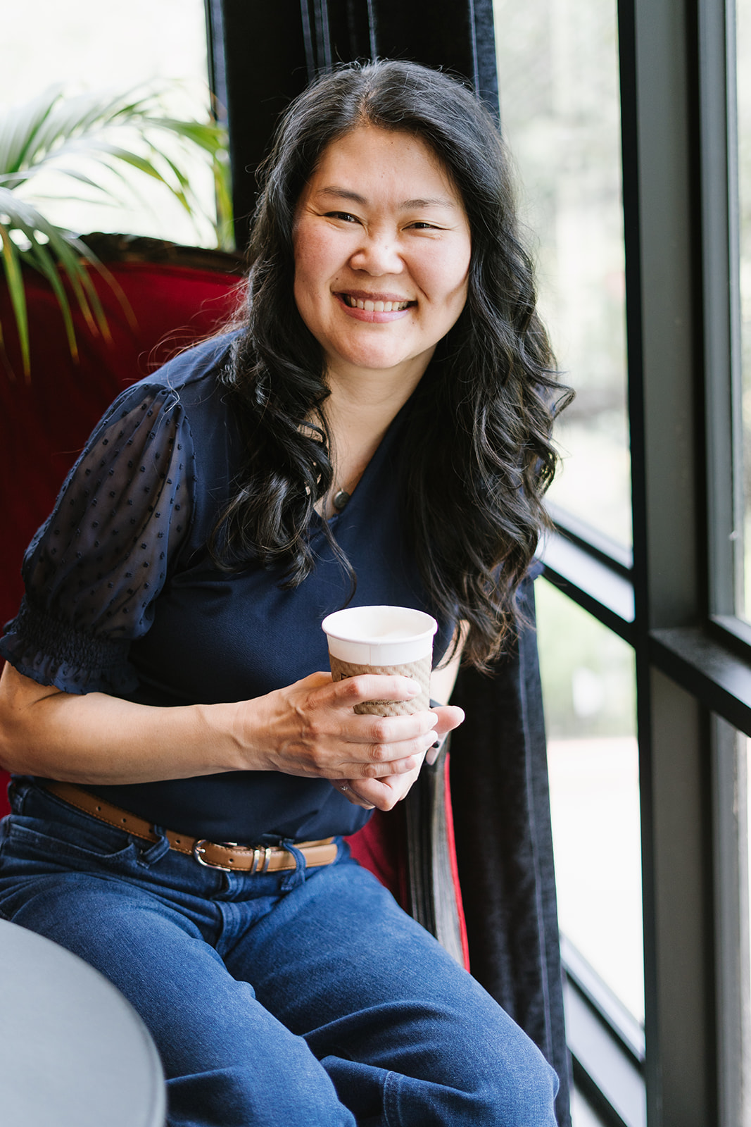 Jana Gross, Austin family photography, sitting with a drink at Simona's coffee shop.